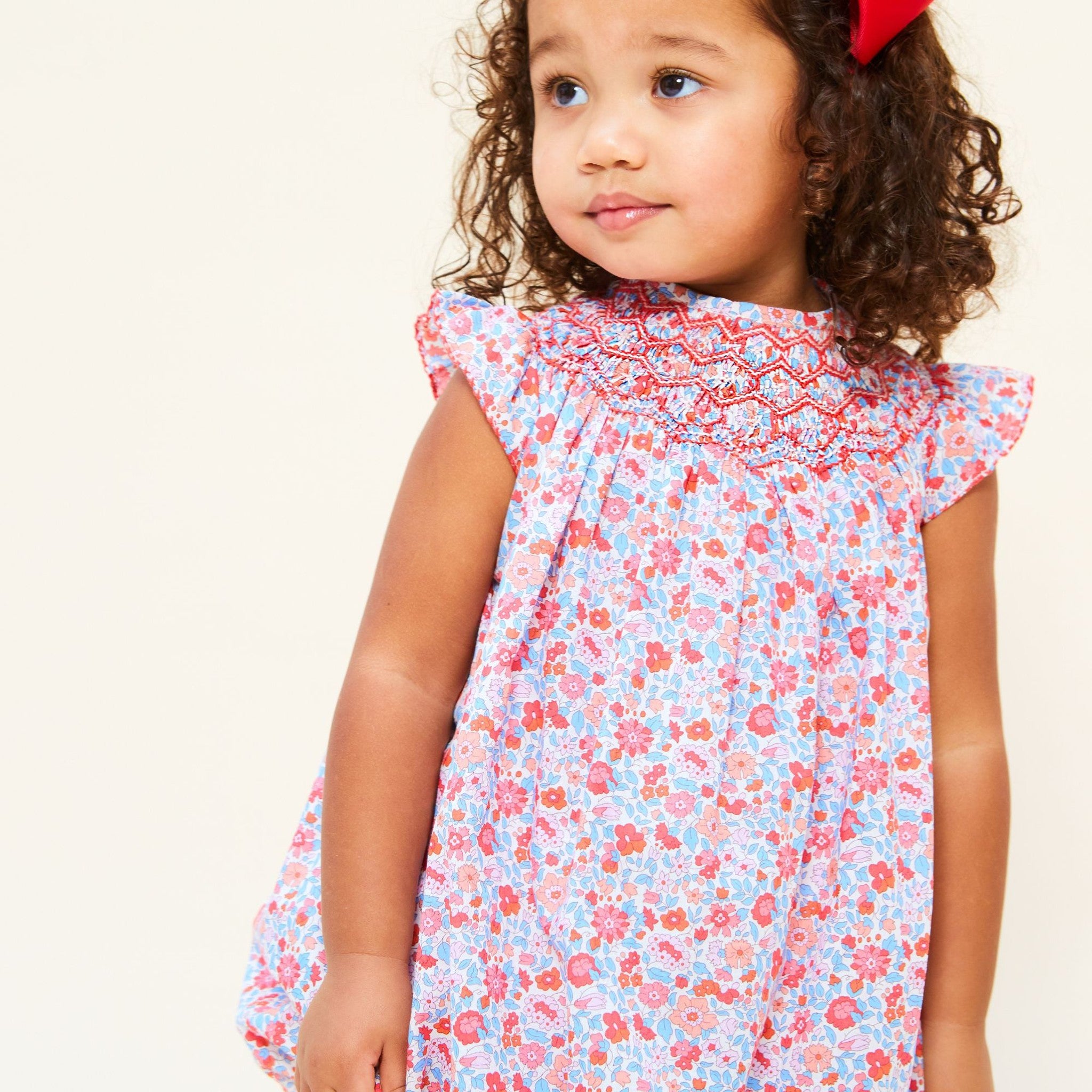 COCO ROMPER WITH CARNATION HAND SMOCKING MADE WITH LIBERTY THERESA PINK