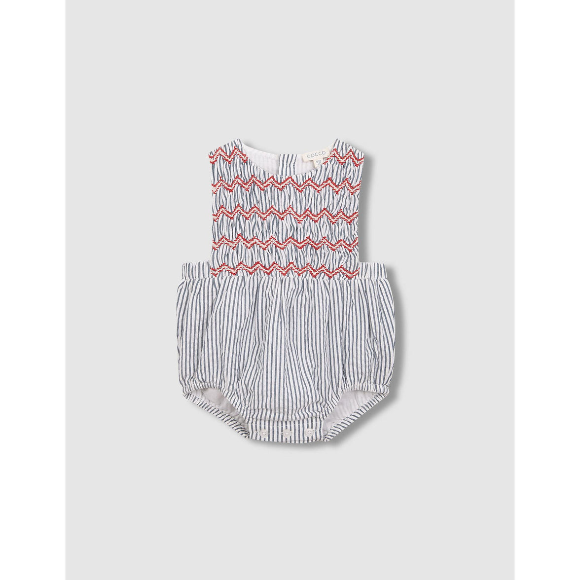 Ranita de rayas con smock azul claro