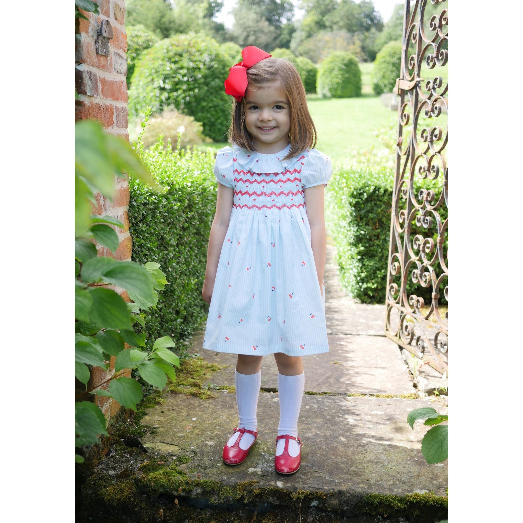 KATHERINE JOHNSON DRESS CHERRY STRIPES WITH MARASCHINO HAND SMOCKING