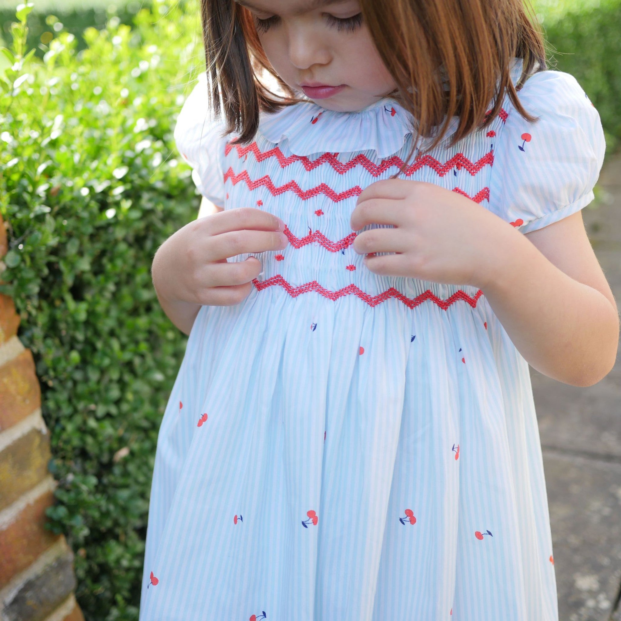 KATHERINE JOHNSON DRESS CHERRY STRIPES WITH MARASCHINO HAND SMOCKING