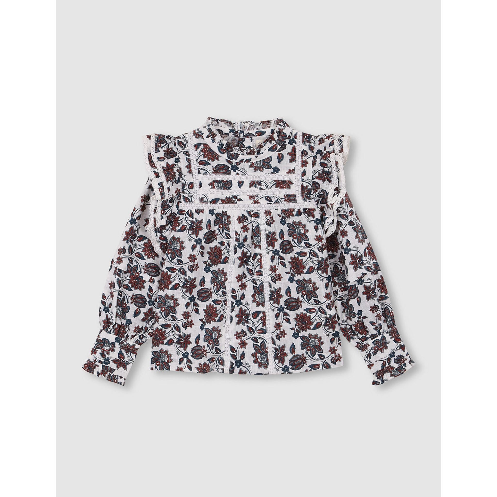 Blusa floral con volantes y tiras bordadas blanco