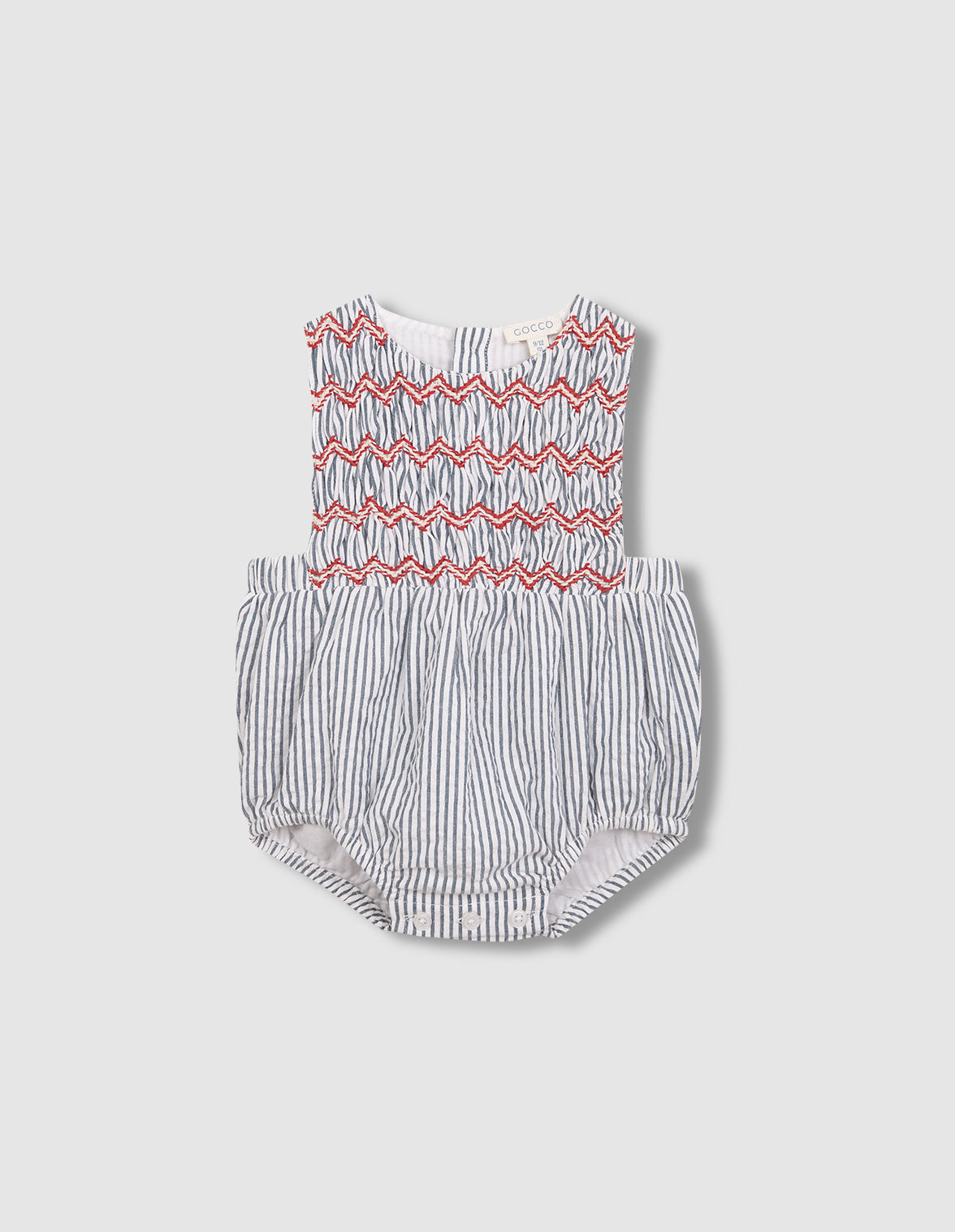 Ranita de rayas con smock azul claro